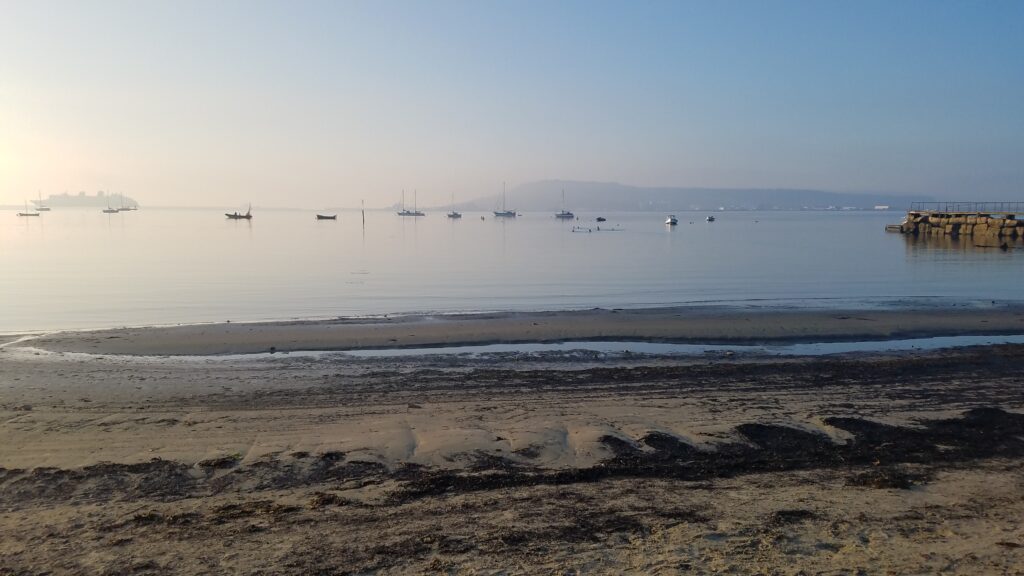 Flat calm day sandsfoot beach Weymouth
