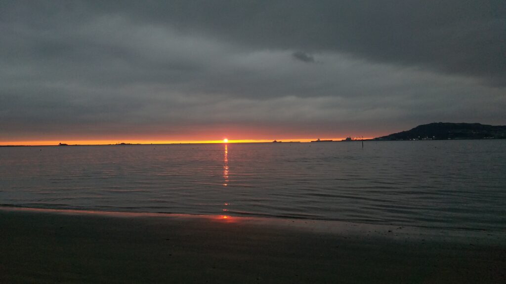 Dawn breaking the sea surface Sandsfoot weymouth
